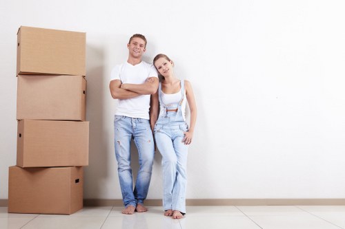 A Docklands moving team preparing belongings for transport in a modern apartment area