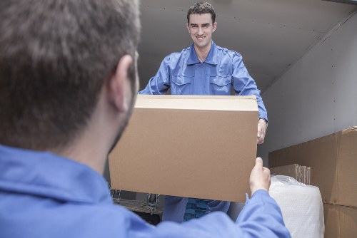 Furniture removals team working with Docklands apartment access and loading area