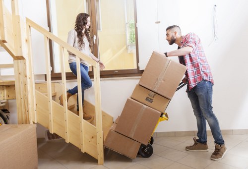 Furniture pick-up crew navigating lift and access challenges in Docklands